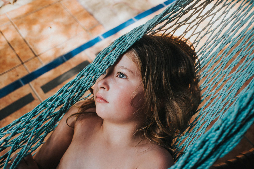 girls face in hammock at tico adventure lodge playa samara costa rica