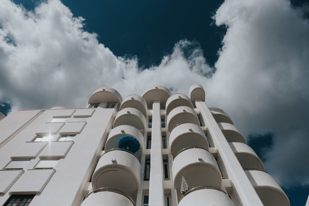 Ibiza photography santa eulalia hotel block with blue umbrella