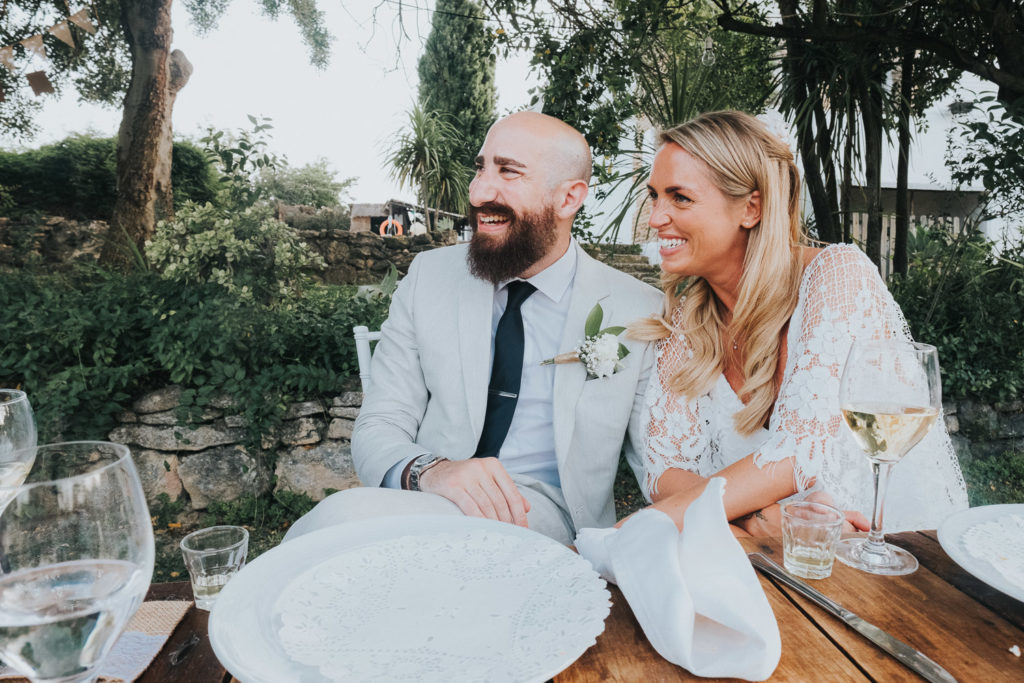 bride and groom listening to speeches smiling jerez wedding photographer