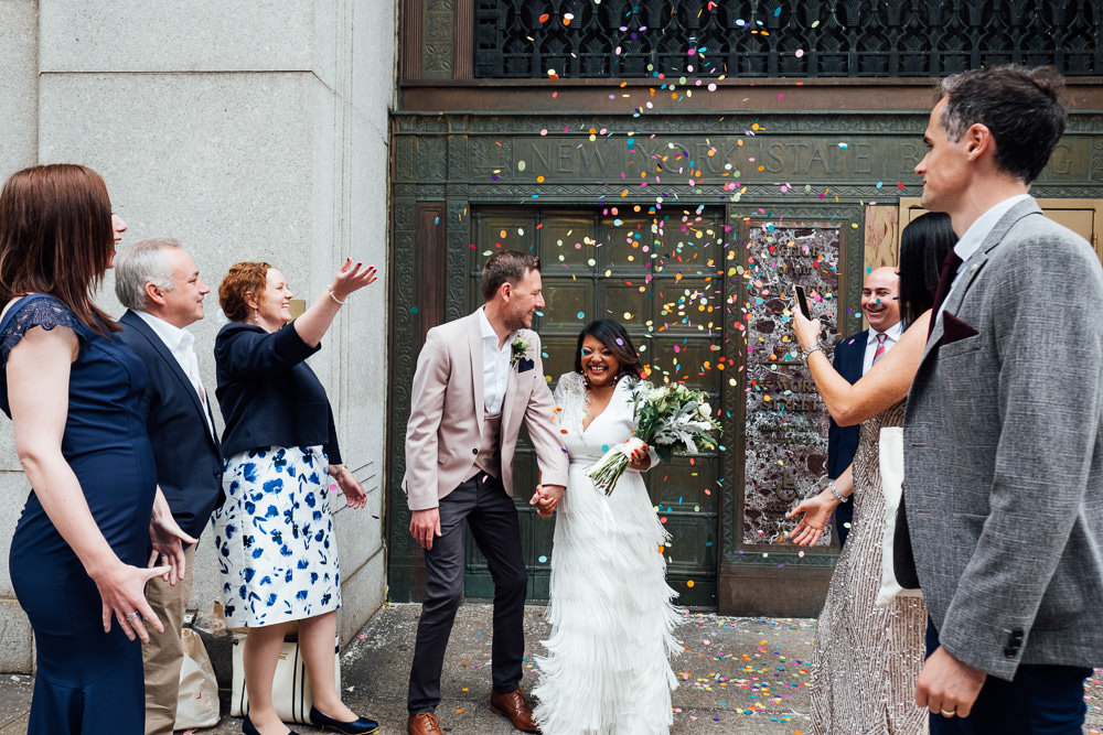 wedding confetti outside city hall new york city