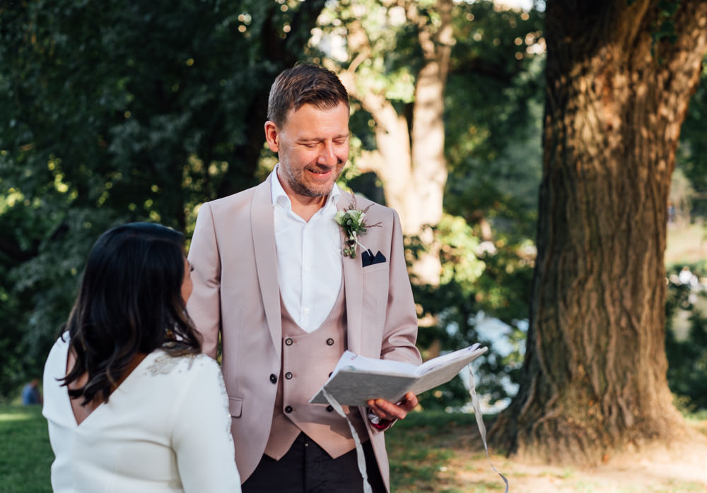 Intimate Central Park wedding ceremony blessing bride and groom