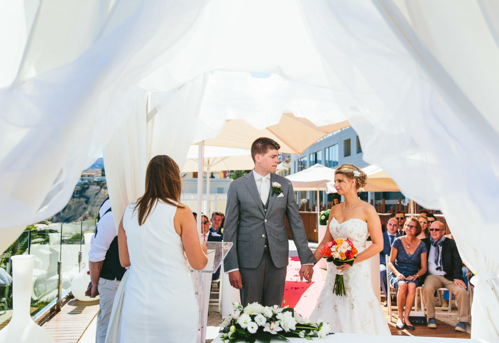 SOL Y MAR CALPE COSTA BLANCA WEDDING PHOTOGRAPHER BRIDE AND GROOM GREETING AT CEREMONY