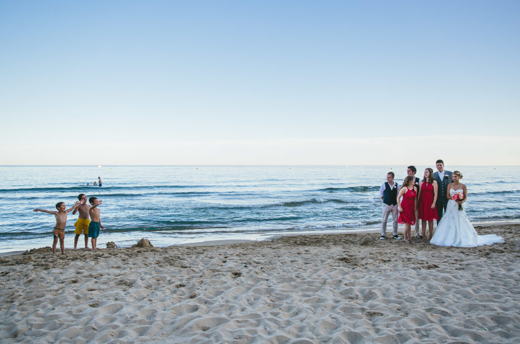 SOL Y MAR CALPE COSTA BLANCA WEDDING PHOTOGRAPHER BRIDE AND GROOM WALKING ON BEACH