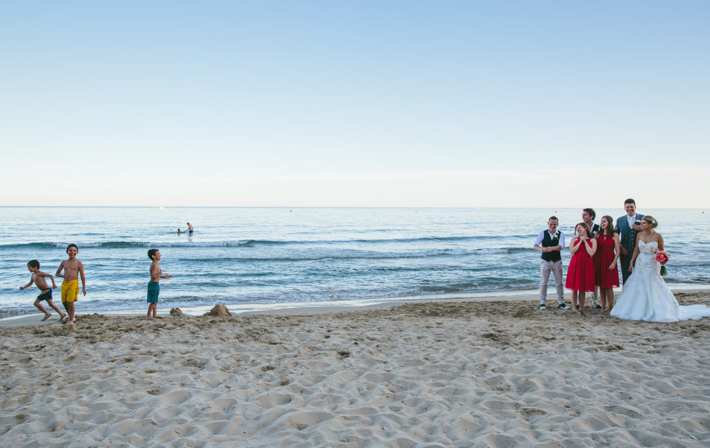 SOL Y MAR CALPE COSTA BLANCA WEDDING PHOTOGRAPHER BRIDE AND GROOM WALKING ON BEACH