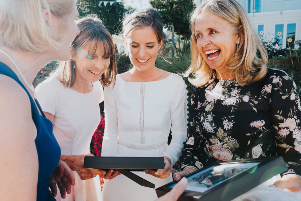 kent wedding photographer bride receiving surprise present from friends