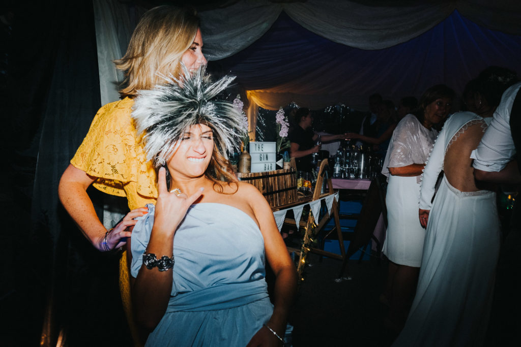 bridesmaid in wig on dancefloor kent wedding photographer