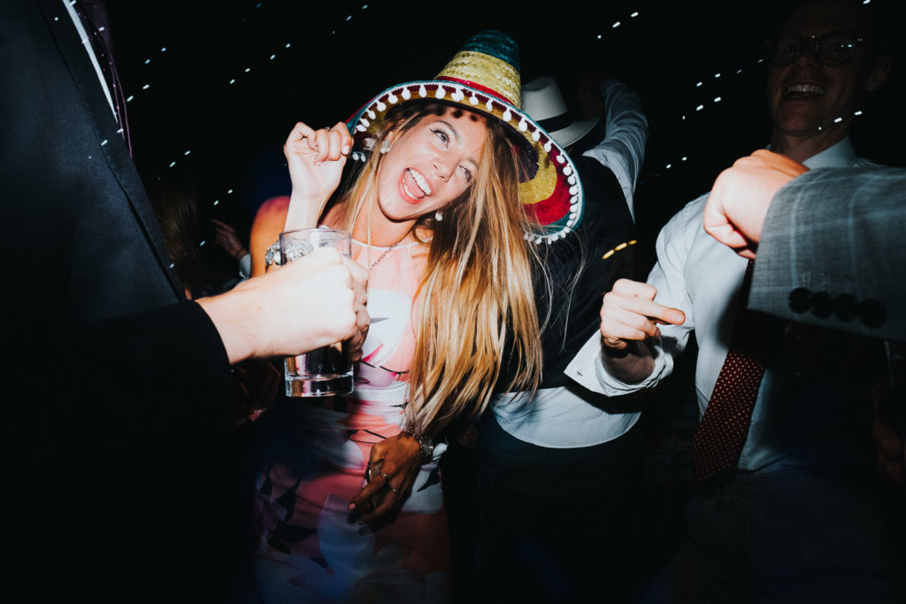 kent wedding photographer wedding guest on dacefloor wearing sombrero hat