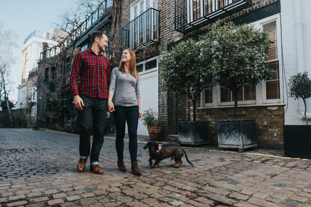 COUPLE WALKING ON MEWS STREET IN LONDON WITH SAUSAGE DOG SOUTH KENSINGTON PHOTOGRAPHER